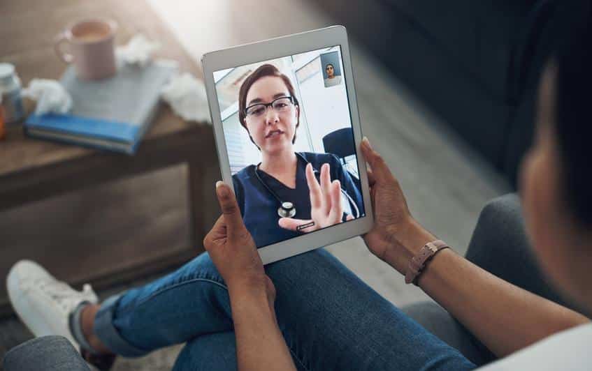 Tablet, virtual consulting with a doctor and a patient in the home for healthcare, medical or online meeting. Video call, telehealth and remote with a person talking to a medicine professional expert.